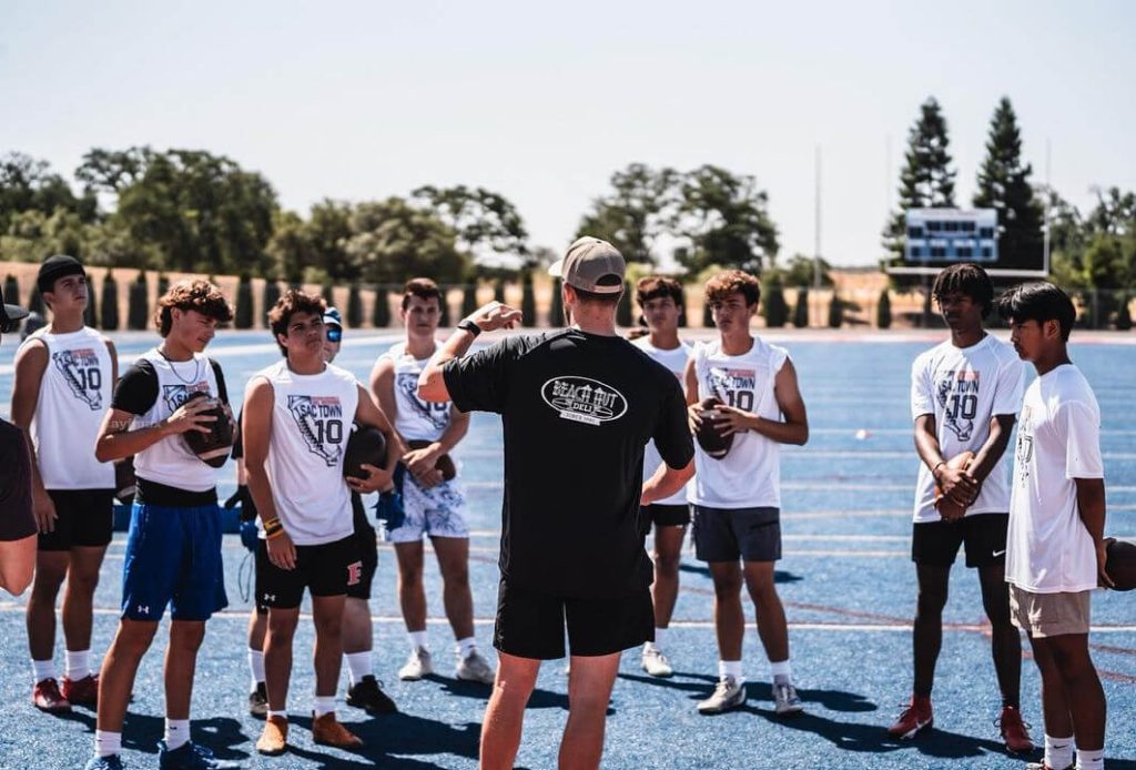 Jake speaking to young athletes