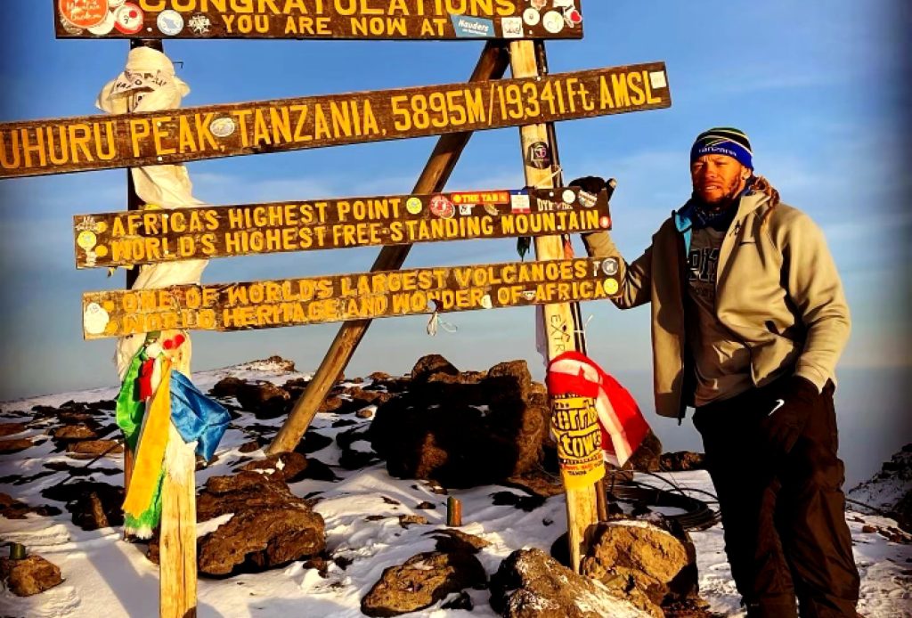 Jabaal at the peak of Mr. Kilimanjaro